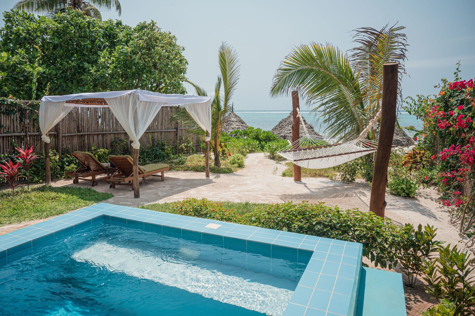 Private plunge pool of a beachfront bungalow facing the ocean